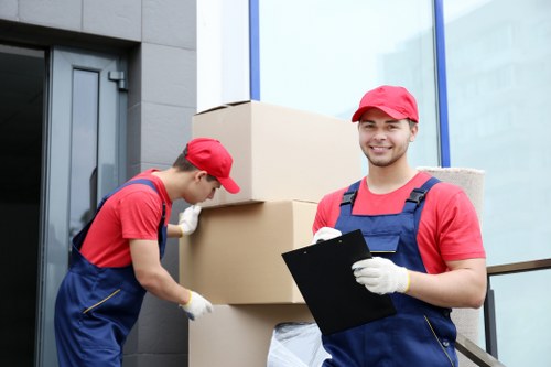 Local movers navigating a busy Soho street with moving van
