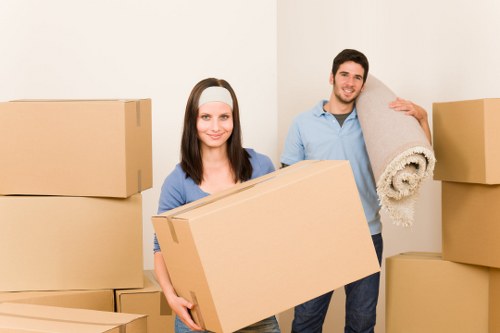 Business relocation team handling desks and IT items in a Soho office move